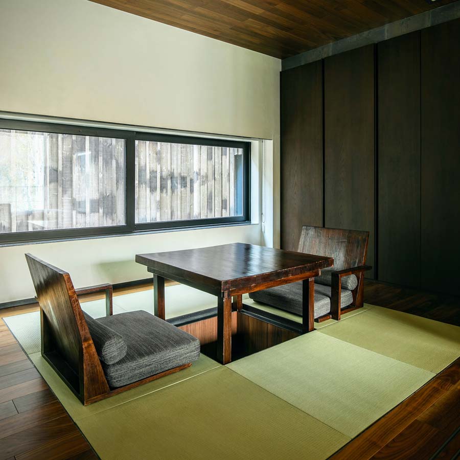 A low table and floor chairs in one of Zaborin's tatami guest spaces.